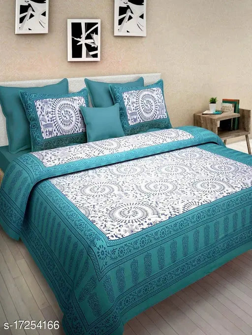 Jaipuri cotton double bed bedsheet combo pack, featuring 2 bedsheets and 4 pillow covers with a vibrant tribal pattern. Ideal for summer use in adult bedrooms. Made in India