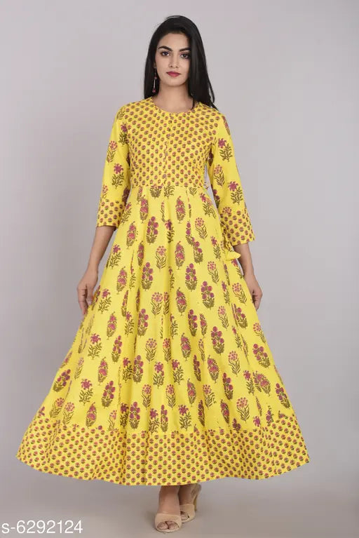 Yellow cotton flared printed kurti for women, three-quarter sleeves, Indian handcrafted fashion on mannequin