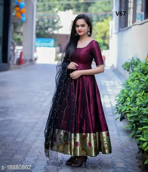 Purple tapeta silk gown with jacquard pattern, soft net pearl work dupatta and short sleeves. Indian ready-made formal wear