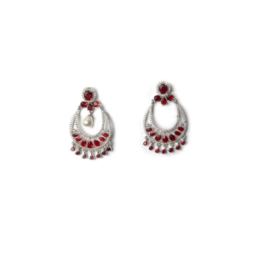 Women's brass silver plated red chandbali earrings on dresser, elegant jewelry accessory for special occasions