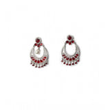 Women's brass silver plated red chandbali earrings on dresser, elegant jewelry accessory for special occasions