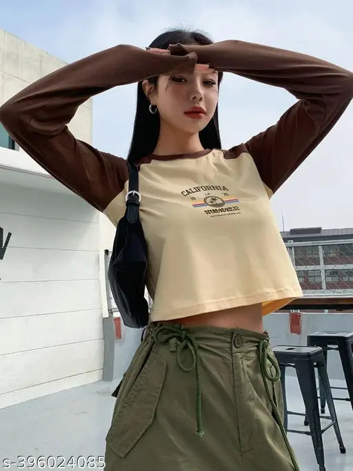 Cotton blend crop raglan t-shirt with printed design, short sleeves, size chart for reference