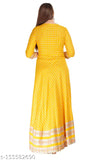 Women's yellow rayon printed long Anarkali kurti with three-quarter sleeves, perfect for festivals and events. High-quality rayon material ensures comfort and breathability. Available in sizes S-XXXL under 500 INR each. Indian handcrafted design