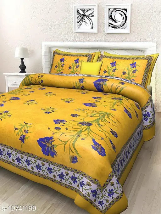 Yellow cotton floral Jaipuri double bed sheets with 2 pillow covers, vibrant flower print on display