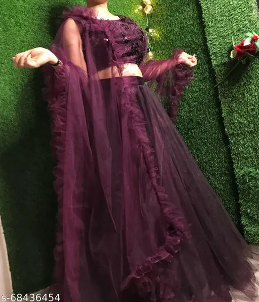 Grey jute-silk chaniya choli with net dupatta, featuring embroidery and ruffles. Semi-stitched lehenga (38" waist, 42" length) and free-size dupatta (2.5m length). Wine-colored lehenga choli with mirror work and beautyful sequence work. Indian bridal or partywear, Indo Western style