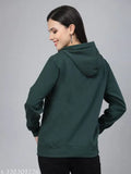 Green cotton oversized sweatshirt with hood by Style Quotient, full sleeves and relaxed fit