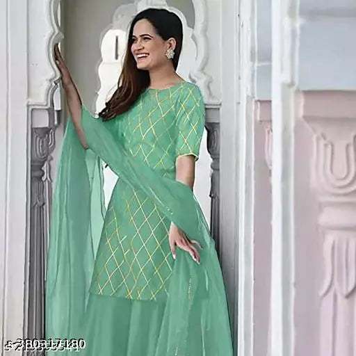 Rayon printed kurta sharara set with net dupatta & cotton bottomwear on display, traditional Indian women's fashion in vibrant prints