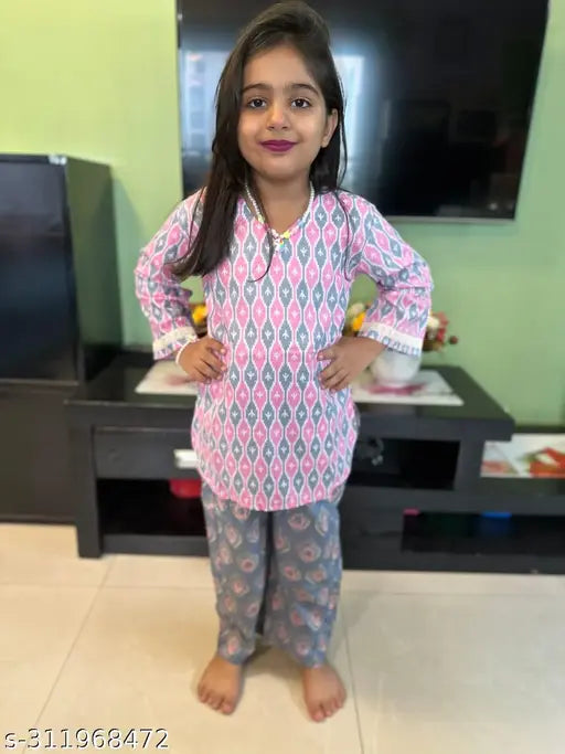 Three-quarter sleeve coord set for girls, printed cotton top and bottom, lace detail at sleeves. Vibrant floral fusion print loungewear. India origin