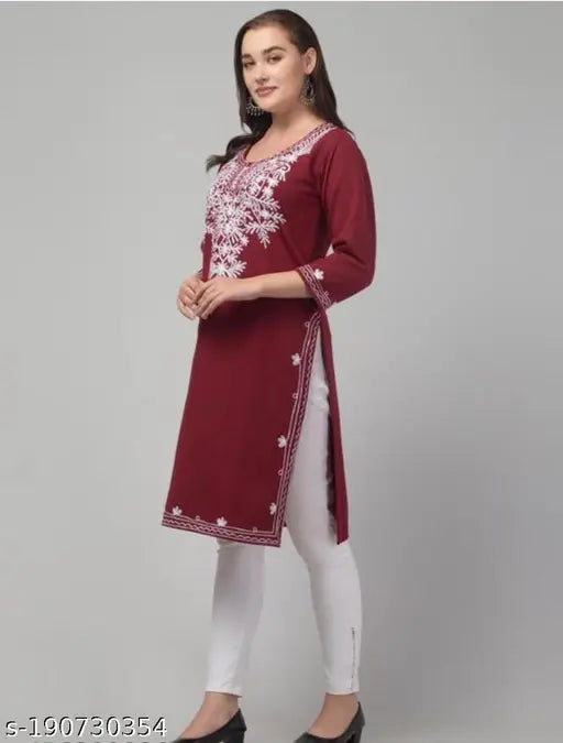 Woolen aari work kurti with embroidered patterns, three-quarter sleeves. Handcrafted woolen kurti from India
