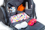 Black multipurpose diaper bag by VParents, features 11 pockets for mom essentials