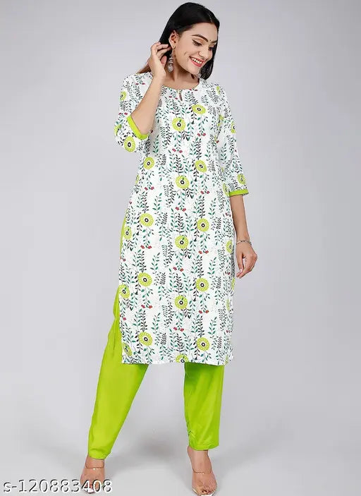 Attractive white and perot color rayon floral print woman's kurta pant set with three-quarter sleeves, featuring palazzo bottoms. Rayon material. Indian origin