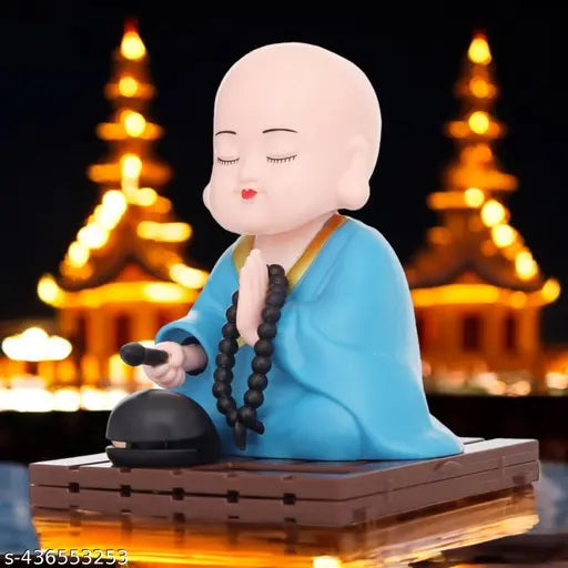 Solar-powered Buddha Monk Statue with moving head & hand, enhancing health, wealth, and prosperity at home or office desks, car dashboards, or other decorative spaces. High-quality plastic figure with an inbuilt solar light panel, no battery or plug required