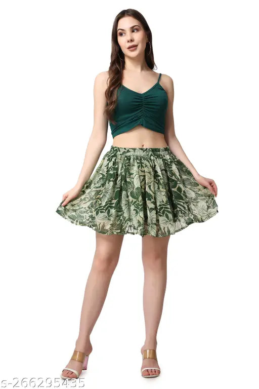 Green chiffon floral mini skirt, printed with vibrant flowers, soft and comfortable for women's fashion. Chiffon, flared, above knee style. Available sizes: 26 (waist 26in, hip 36in), 28 (waist 28in, hip 38in), 30 (waist 30in, hip 40in), 32 (waist 32in, hip 42in), 34 (waist 34in, hip 44in). Origin: India