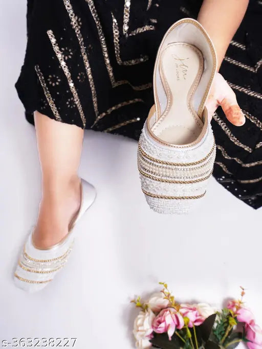 Synthetic jutti bellies sandals in vibrant colors, comfortable sole and stylish design for women footwear