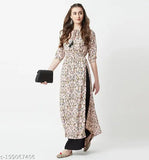 Multicolor peach floral maxi top with round neck, 3/4 sleeves, tassel detailing & front slit. Indian women's fashion