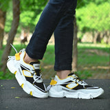 Yellow synthetic leather sports shoes, lightweight and fashionable for athletic activities