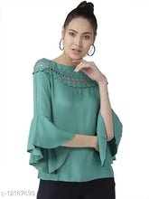 Green viscose rayon A-line top with three-quarter sleeves, solid design by Style Quotient for women's fashion