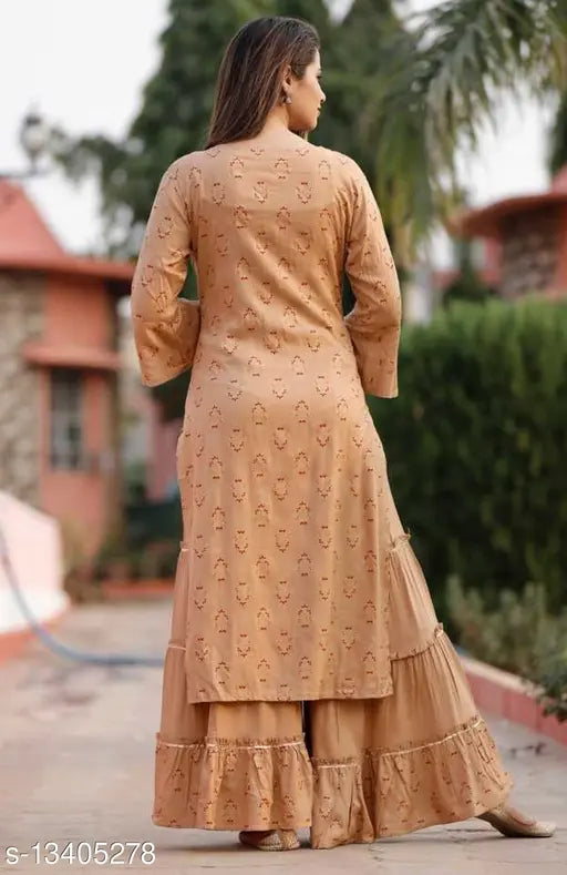 Women's printed daily wear rayon kurta set with sharara, three-quarter sleeves, Indian fashion in net pattern