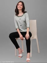 Green cotton blend mirror-worked top with three-quarter sleeves, embellished net pattern for festive and party wear, handmade in India