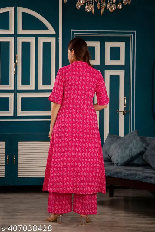 Pink cotton A-Line kurta set with palazzos, Katha work, three-quarter sleeves, and printed design. Indian party wear for women." (109 characters)