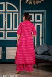 Pink cotton A-Line kurta set with palazzos, Katha work, three-quarter sleeves, and printed design. Indian party wear for women." (109 characters)