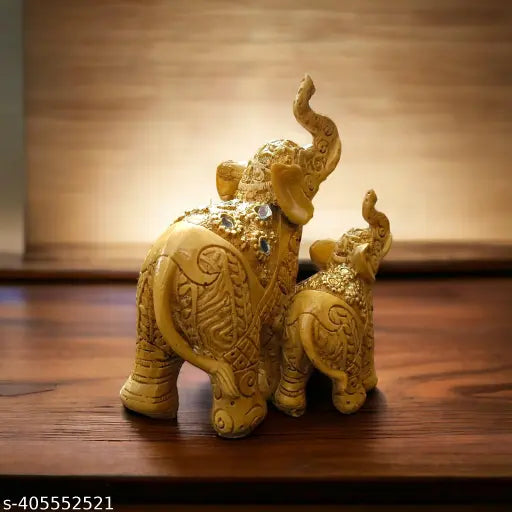 Yellow resin elephant showpiece set (12cm L x 15cm H x 9cm B), symbolizing family bond for home decor or gifting