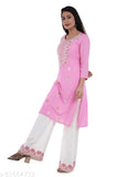 Embroidered rayon kurta set with palazzo, featuring three-quarter sleeves and print all over. Stylish women's attire from Elvish Jaipur, India