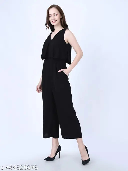 Black cotton blend solid color full-length sleeveless jumpsuit for women & girls with two side pockets, suitable for various occasions like homewear, school, shopping, beach, and outdoor activities. Made in India