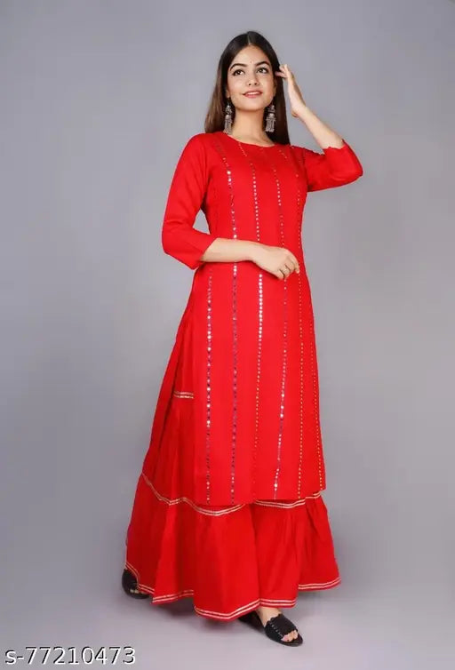 Solid color rayon kurta with sharara set, three-quarter sleeves, embellished net pattern. Indian fashion for women