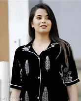 Black cotton nightsuit set for women, featuring printed kaftan-style top with matching pyjamas. Soft satin fabric, comfortable and stylish sleepwear for all seasons. Indian origin