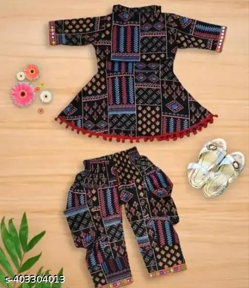 Printed black cotton blend dhoti pants and kurta set - traditional Indian girls' clothing with A-line top and short sleeves