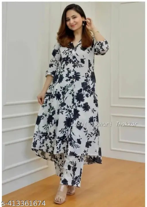 Black rayon kurta and pants set with printed net pattern, three-quarter sleeves. Indian party wear ethnic fashion set in sizes M, L, XL, XXL