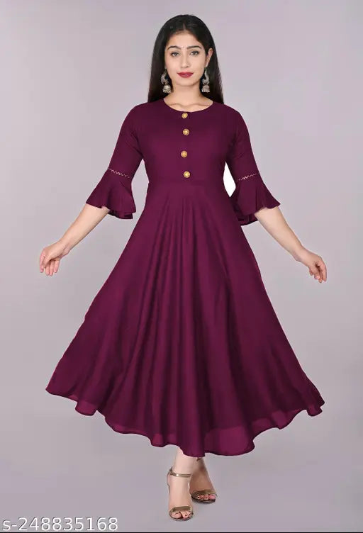 Purple rayon flared kurti with embroidered pattern, suitable for casual and formal occasions. Size range from XS to XXXL. Hand wash or machine wash recommended. Made in India