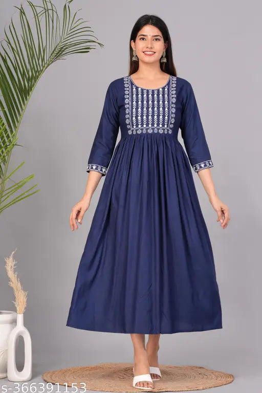 Blue Rayon Embroidered Flared Kurta with three-quarter sleeves, solid design. Women's fashion apparel on hanger, featuring floral print