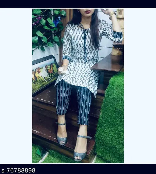 White and Black Stylish Rayon Kurta Pant Set - Printed casual Indian set for modern women, features three-quarter sleeves and pants made from comfortable Rayon fabric