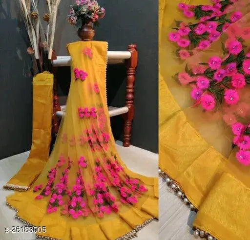 Mustard net saree with floral embroidery and pearl borders - elegant Indian attire for special occasions