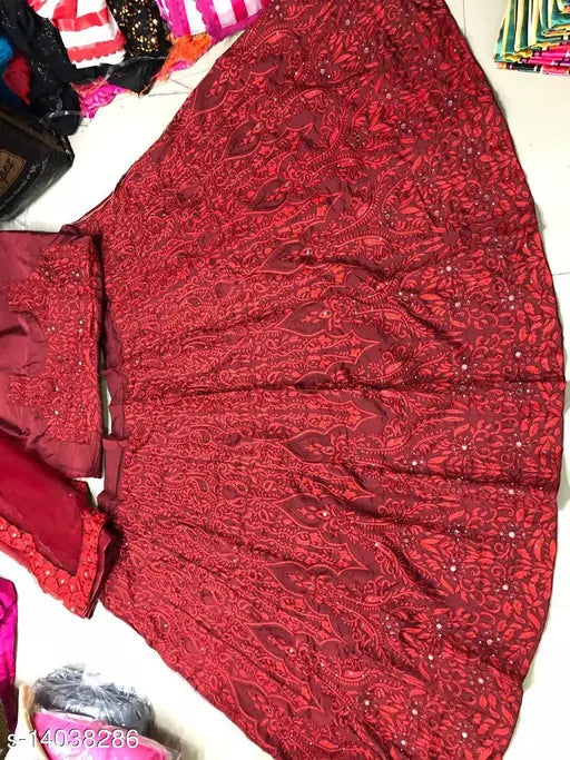 White net lehenga with chain and diamond work, embroidered Indian bridal attire on display