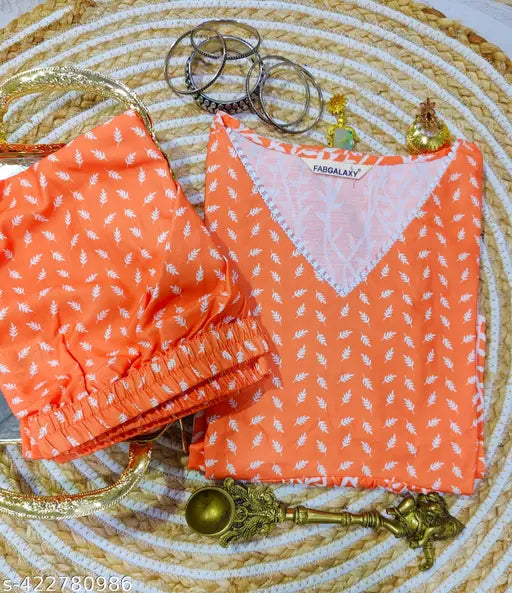 Orange and white floral print Rayon kurti pant set with palazzos, intricate cotton lace detailing