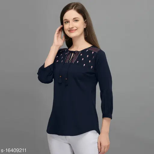 Navy blue embroidered western top, polyester with three-quarter sleeves. Prettify trendy women's top, embellished net pattern. Women's fashion, navy blue embroidery on Indian-made apparel