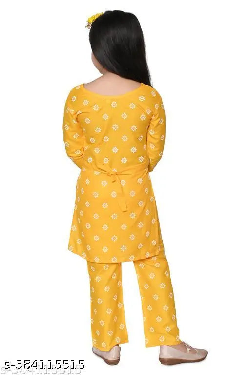Kids girls rayon print kurta palazzo set, knee length straight top with three-quarter sleeves. Colors and patterns inspired by Indian ethnic wear. Multiple sizes available for 4-9 years old. Made in India