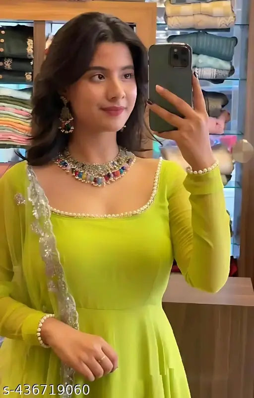 Parrot green Georgette kurta with long sleeves and no bottomwear, solid pattern, single size available for XS to XXL. Indian traditional attire on display