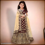 Acrylic kids' lehenga choli with short sleeves, embroidered top and net dupatta. Indian girls party wear outfit