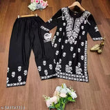 Embroidered net rayon kurta and palazzo set, Indian-inspired party dress for women in various sizes, three-quarter sleeve, chikankari work on display