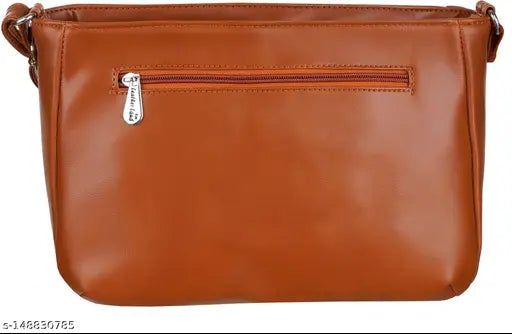 Tan leather sling bag, faux leather design, features 2 main compartments & a zipper pocket, waterproof, lightweight, trendy accessory from India