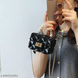 Embellished net PU leather mini sling bag with chain for girls. Waterproof, easy to clean, and dual-use (handbag/crossbody). Perfect for daily essentials like candy, keys, or small toys