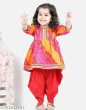 Red bandhej anarkali kurta set with dhoti pants, embellished with lace and bandhani work on cotton rayon. Indian party wear for girls aged 1-8 years
