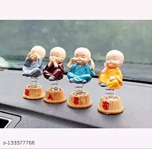 Multicolor spring Buddha figurines set of 4, intricately handcrafted poly resin religious idols for car dashboard decoration or home showpiece