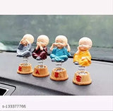 Multicolor spring Buddha figurines set of 4, intricately handcrafted poly resin religious idols for car dashboard decoration or home showpiece