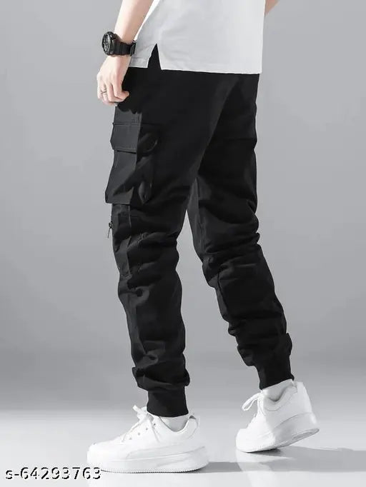 Men's black cotton cargo pants with patch detail, elastic drawstring waist and multiple pockets