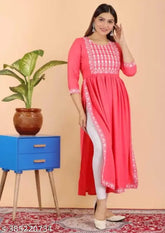 Pink embroidered rayon A-line kurta with three-quarter sleeves. Versatile, stylish women's short kurta from India